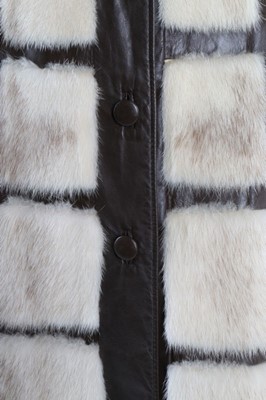 Lot 121 - A mink coat with brown leather trim, circa...