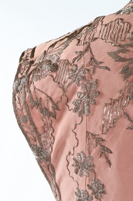 Lot 129 - A finely embroidered empire-style couture pink...
