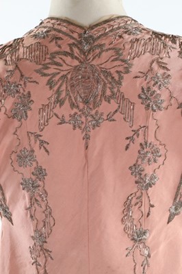 Lot 129 - A finely embroidered empire-style couture pink...