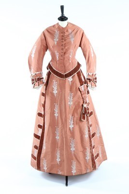 Lot 132 - A brocaded cinnamon taffeta gown, circa 1876,...