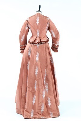 Lot 132 - A brocaded cinnamon taffeta gown, circa 1876,...