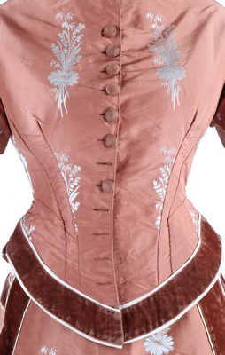 Lot 132 - A brocaded cinnamon taffeta gown, circa 1876,...