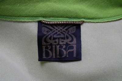 Lot 148 - A Biba acid-green jersey trouser suit, early...
