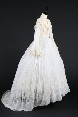 Lot 394 - A whiteworked muslin dress, circa 1860, the...