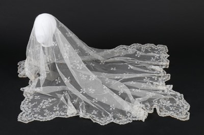 Lot 394 - A whiteworked muslin dress, circa 1860, the...