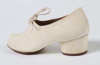 Lot 131 - A pair of Ferragamo 'Ferrina' white suede...