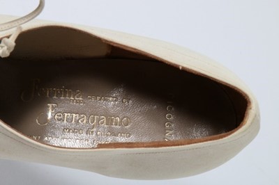 Lot 131 - A pair of Ferragamo 'Ferrina' white suede...