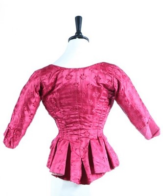 Lot 169 - A wine damask satin lady's bodice, 1770s, with...