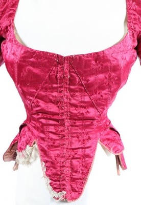 Lot 169 - A wine damask satin lady's bodice, 1770s, with...