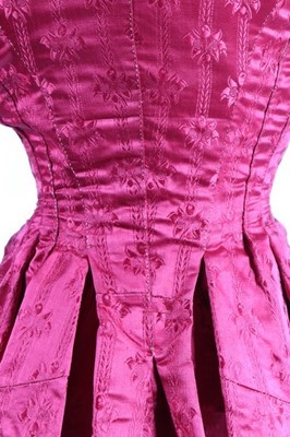 Lot 169 - A wine damask satin lady's bodice, 1770s, with...