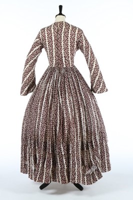 Lot 170 - A printed muslin day dress, late 1840s, with...
