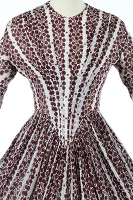 Lot 170 - A printed muslin day dress, late 1840s, with...