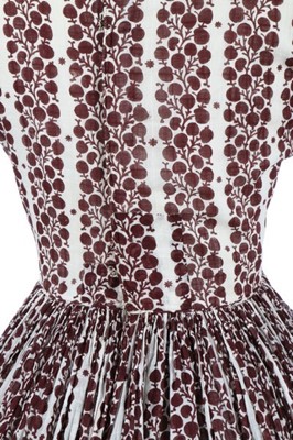 Lot 170 - A printed muslin day dress, late 1840s, with...