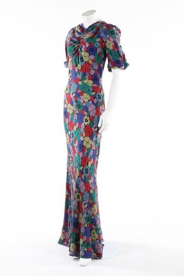 Lot 176 - A printed floral crepe garden party gown, mid...