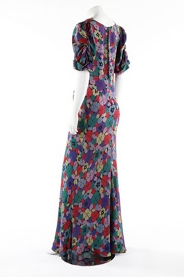 Lot 176 - A printed floral crepe garden party gown, mid...