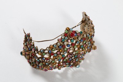 Lot 184 - A good group of headwear and haircombs,...