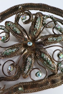 Lot 184 - A good group of headwear and haircombs,...