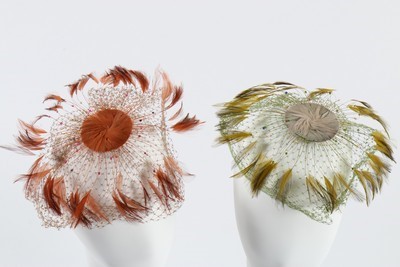 Lot 185 - A group of exotic feather hat ornaments, silk...