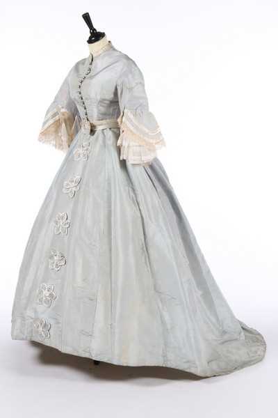 Lot 210 - A pale blue silk gown with day and evening...