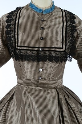 Lot 211 - A black and tan striped taffeta dress, late...
