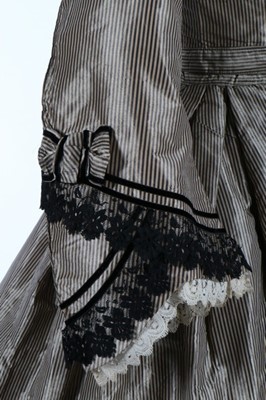 Lot 211 - A black and tan striped taffeta dress, late...