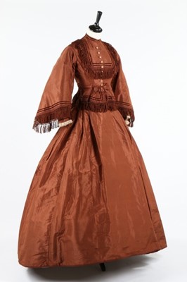 Lot 212 - A brown taffeta day dress circa 1870, the...