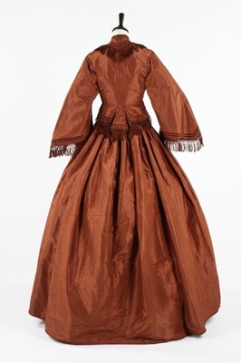 Lot 212 - A brown taffeta day dress circa 1870, the...