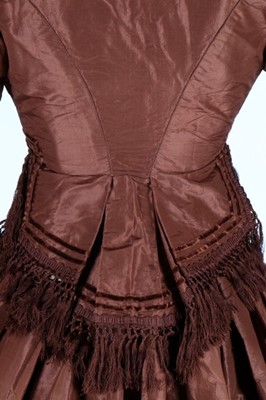 Lot 212 - A brown taffeta day dress circa 1870, the...