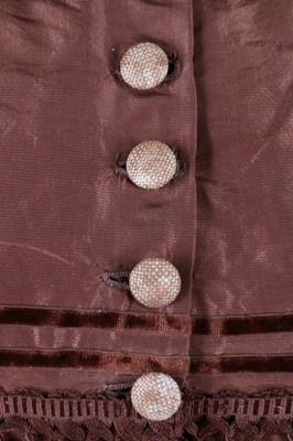 Lot 212 - A brown taffeta day dress circa 1870, the...