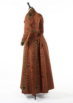Lot 213 - A brown moire dress, circa 1890, comprising...