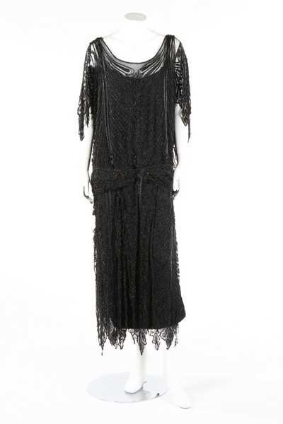 Lot 215 - A Paquin black beaded tulle flapper dress,...