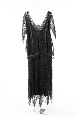 Lot 215 - A Paquin black beaded tulle flapper dress,...