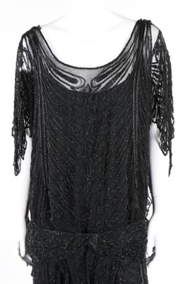 Lot 215 - A Paquin black beaded tulle flapper dress,...