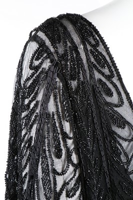 Lot 215 - A Paquin black beaded tulle flapper dress,...