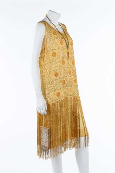 Lot 216 - A beaded yellow muslin flapper dress with...