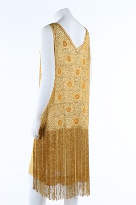 Lot 216 - A beaded yellow muslin flapper dress with...