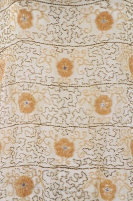 Lot 216 - A beaded yellow muslin flapper dress with...