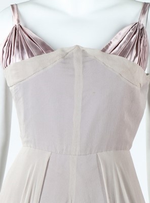 Lot 235 - A Dior London black velvet evening coat, late...