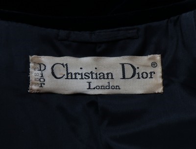 Lot 235 - A Dior London black velvet evening coat, late...