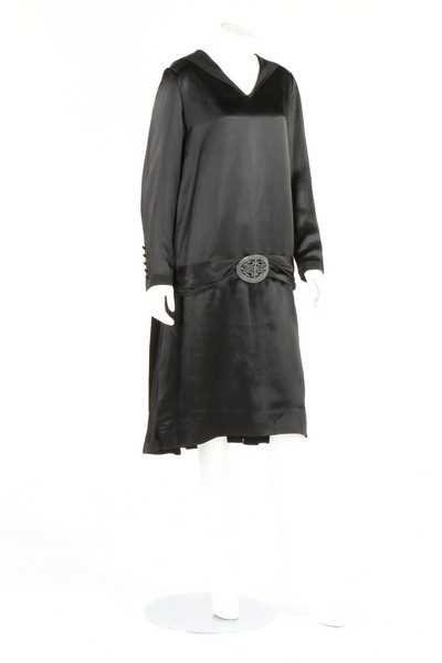 Lot 267 - A black satin dinner dress, circa 1925,...