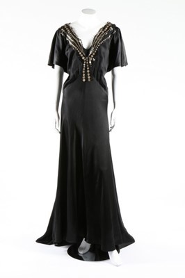 Lot 271 - A black satin bias-cut evening gown with...