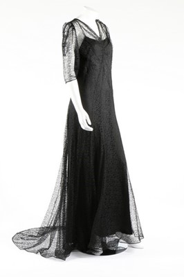 Lot 271 - A black satin bias-cut evening gown with...