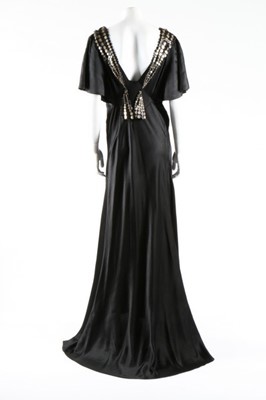 Lot 271 - A black satin bias-cut evening gown with...