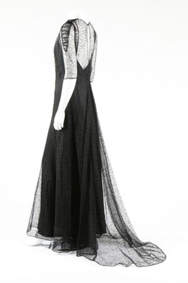 Lot 271 - A black satin bias-cut evening gown with...