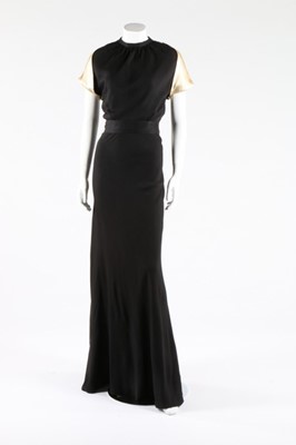 Lot 272 - A black crepe and ivory satin evening ensemble,...