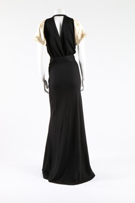 Lot 272 - A black crepe and ivory satin evening ensemble,...