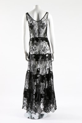 Lot 272 - A black crepe and ivory satin evening ensemble,...