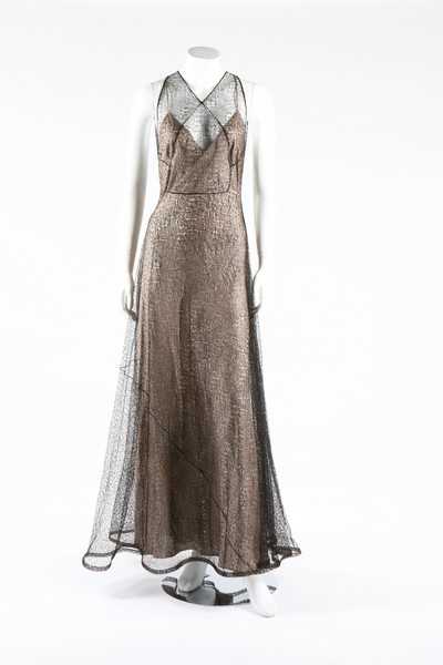 Lot 273 - A cob-web fine black knitted lace evening...