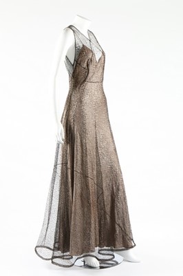 Lot 273 - A cob-web fine black knitted lace evening...