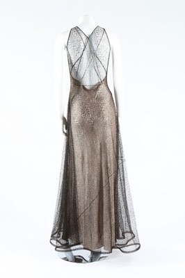 Lot 273 - A cob-web fine black knitted lace evening...